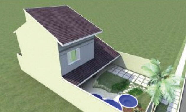 Casa com piscina construída nos fundos do terreno.